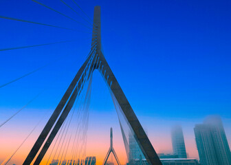 Boston City Skyline through Leonard P. Zakim Bunker Hill Memorial Bridge on I-93 Interstate Highway...