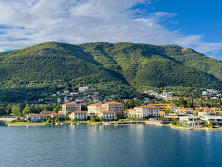 Obraz premium Bay of Kotor, Montenegro - July 2, 2024: One and Only Portonovi hotel and resort in Portonovo. Mountain, cityscape and cloudscape