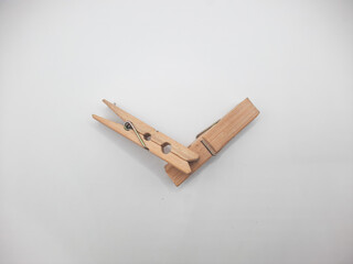 Clothesline clip made of wood with white background 