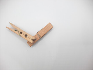 Clothesline clip made of wood with white background 