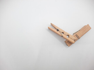Clothesline clip made of wood with white background 