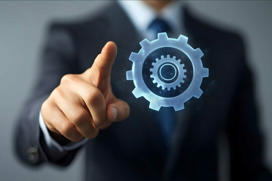 Businessman touching gears in motion on a transparent screen a business concept for system or technology management and process development A businessman with h