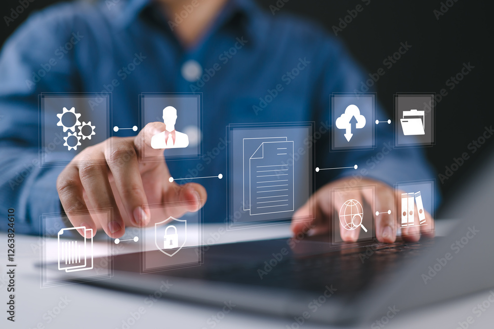 Poster Businessman using a laptop to document management concept, online documentation database and digital file storage system software, records keeping, database technology, file access, doc sharing.