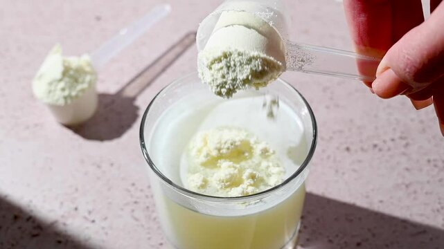 Protein shake and protein powder in a scoop, collagen, creatin, food supplement