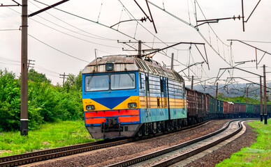Fototapeta premium Ukrainian-built electric locomotive with a freight train near Siversk, currently an active war zone in Russo-Ukrainian War in Donetsk region of Ukraine