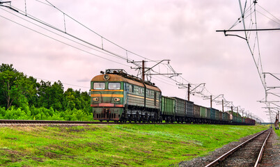 Soviet-built electric locomotive hauling a freight train near Siversk, currently an active war zone in Russo-Ukrainian War in Donetsk region of Ukraine
