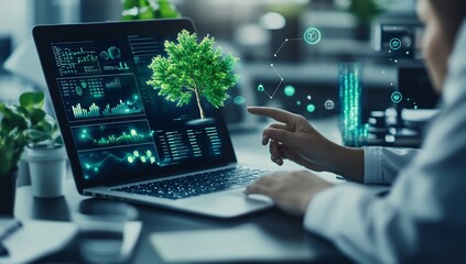 Person using laptop showing a digital tree and data charts, representing sustainable technology.