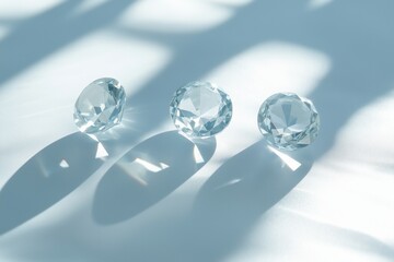 Sparkling diamonds on a soft blue surface with gentle shadow play