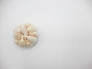 One head of garlic on a white background 