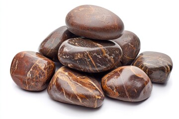 Collection of smooth brown river stones stacked artistically with natural texture and earthy tones against a white background for design elements