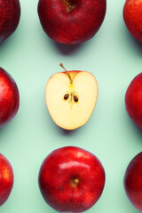 Fresh ripe red apples on light blue background, flat lay