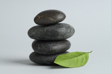 Stack of rocks on gray background. Harmony and life balance