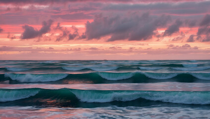 Obraz premium Ocean Waves Crashing at Sunset, Vibrant Pink Hues