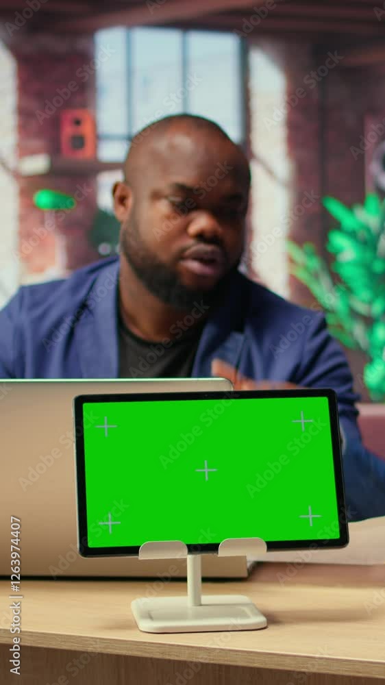 Poster african american couple browse troubleshooting guide next to chroma key, working together to debug r