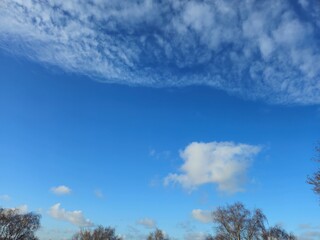 Blue sky with white clouds.Panorama sky with cloud on a sunny day. Very few white clouds and blue skies.