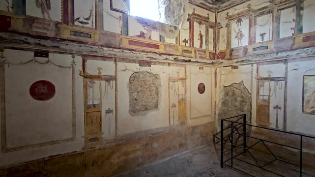 POMPEII, ITALY - MAY 21, 2024: Casa dei Vettii in the ruins of ancient Pompeii-Pan of interior artwork