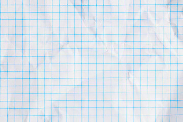 Wrinkled white graph paper with blue grid lines