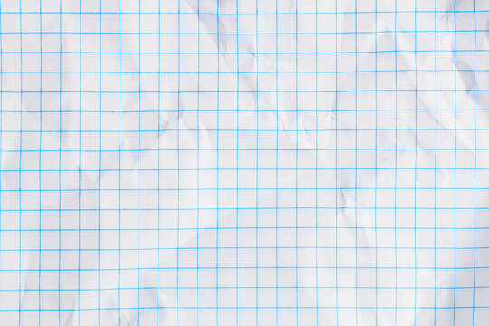 Wrinkled white graph paper with blue grid lines