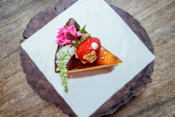 Delicious, soft cheesecake decorated with strawberries.