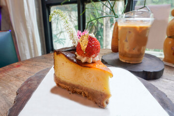 Delicious, soft cheesecake decorated with strawberries.
