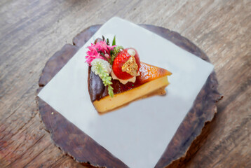 Delicious, soft cheesecake decorated with strawberries.