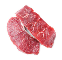 Pieces of raw beef meat isolated on white, top view