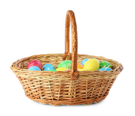 Happy Easter. Bright painted eggs in wicker basket isolated on white