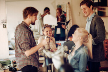 Group of young architects working on a project together in the office