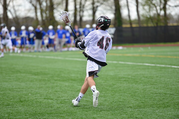 Boy playing lacrosse