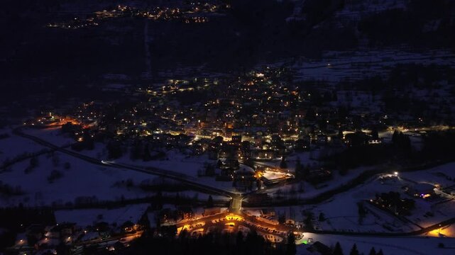 Cold and The roads are magical, but seen by a drone over the mountain with illuminated lights show the beauty of the Olympic site in Italy Cortina 2026. Snow place