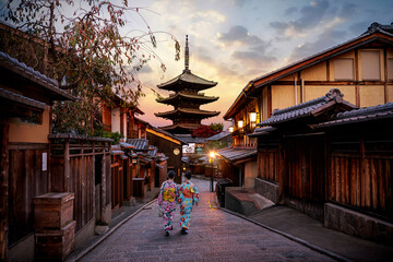 Asian women wearing traditional japanese kimono among at Yasaka Pagoda and Sannen Zaka Street in Kyoto, Japan.