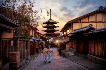 Poster Asian women wearing traditional japanese kimono among at Yasaka Pagoda and Sannen Zaka Street in Kyoto, Japan.
