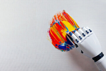 Image creation concept, robotic hand painting on canvas