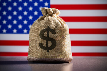 Burlap with dollar banknotes on flag USA background. Banking, investment, payment, tax, tariffs concept.