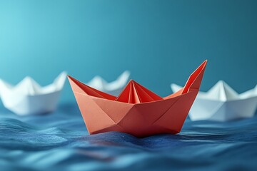 Obraz premium Red Origami Boat Leading the Way: A Symbol of Innovation and Leadership