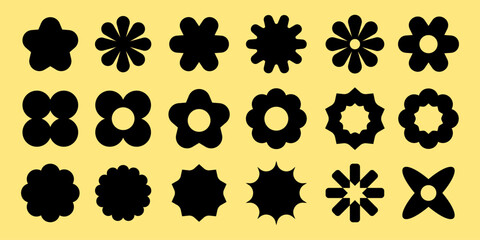 Silhouette flower shapes on yellow. Various flower silhouettes in black. Flower designs, floral patterns, flower motifs, and flower icons in silhouette. Black shapes, vector element set.