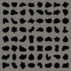 Abstract black shapes on a gray background. Random shapes, abstract design, black shapes pattern. Unique abstract shapes, artistic black shapes. Black shape vector set.