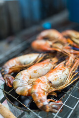 Grilled River shrimps on the flaming grill. Close up