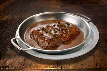 Steak au Poivre served on a tray