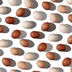 Pattern of Brown and White Eggs with shadows, minimal style aesthetic holiday background, isolated natural organic chicken eggs, breakfast ingredients,  minimalist food composition, neutral color