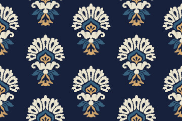Ikat embroidered floral pattern on dark blue background. Traditional ethnic ikat pattern. Abstract Aztec vector pattern. Seamless pattern in tribal, folk and mexican style.