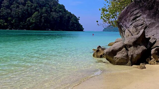 Discover the stunning landscapes of Surin Island in Thailand, where crystal-clear waters meet soft sandy beaches. Enjoy the tranquility and natural beauty of this tropical paradise.