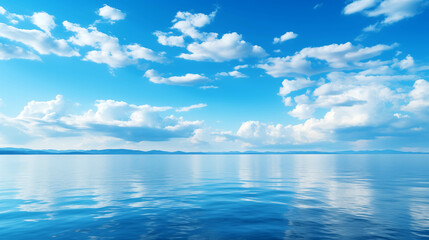 Fototapeta premium Blue sky over calm sea. Blue sea and sunny sky on horizon over calm water