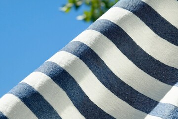 Fototapeta premium Striped fabric texture with blue sky for backgrounds in fashion, textile design