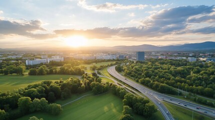 Sunset over city highway park aerial