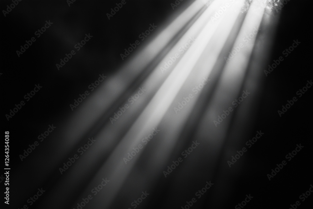 Poster black and white photo of a light shining on a surface. the light is casting shadows and creating a s