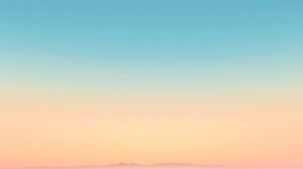 Obraz premium Pastel Sky Hues Over Distant Mountain Range