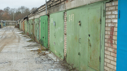 An old garage cooperative featuring vintage garages and weathered doors, showcasing a nostalgic...