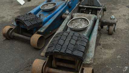 Discover vintage pneumatic jacks at a tire change service, showcasing the evolution of automotive tools. These classic devices highlight the craftsmanship and reliability of past innovations.