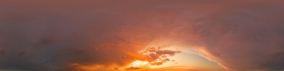 Golden glowing red orange overcast sunset sky 360 hdr panorama. Seamless spherical equirectangular panorama. Sky dome or zenith for 3D visualization and sky replacement for aerial drone 360 panoramas